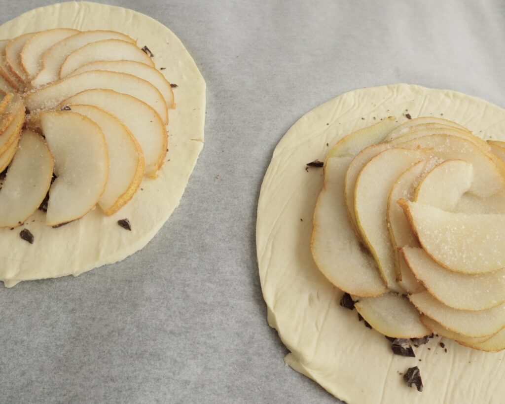 Puff pastry topped with chocolate and sliced pears