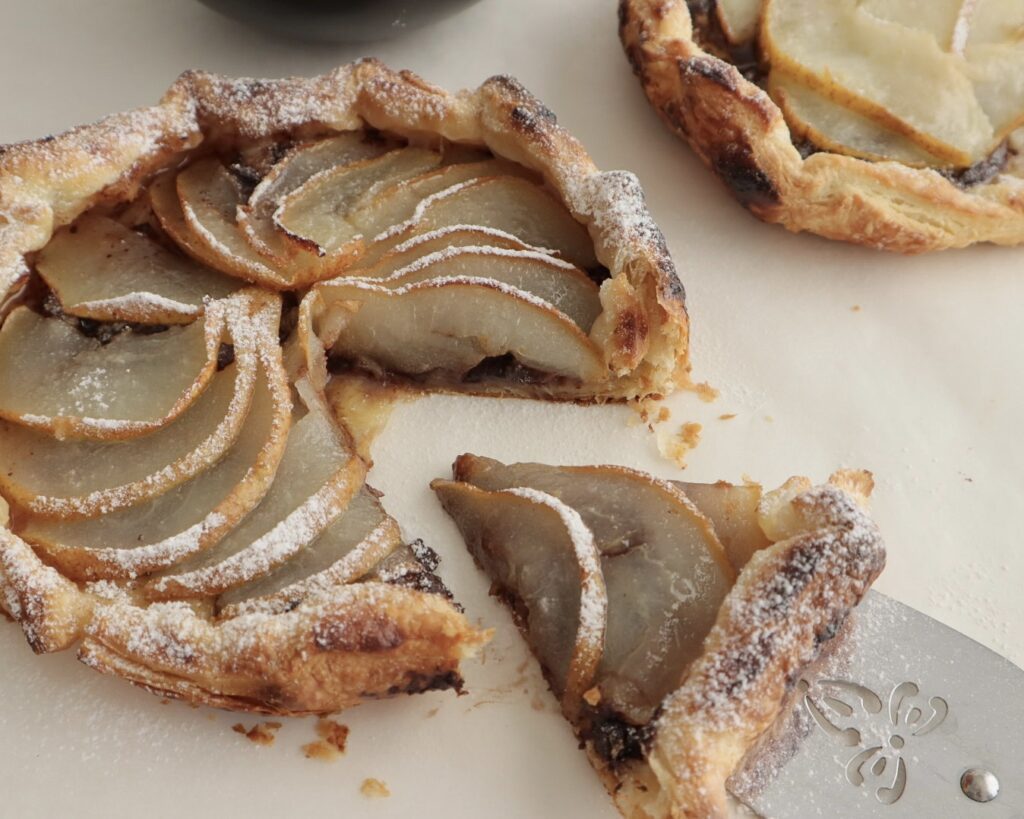 Chocolate and Pear Galette slice being removed