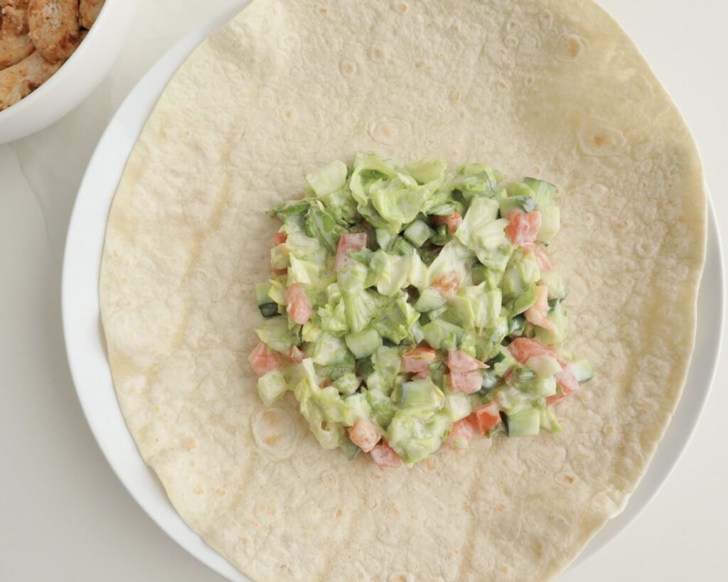 Salad on top of tortilla wrap 