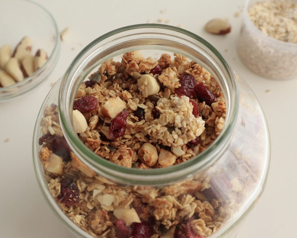 Homemade granola with cranberries in a jar