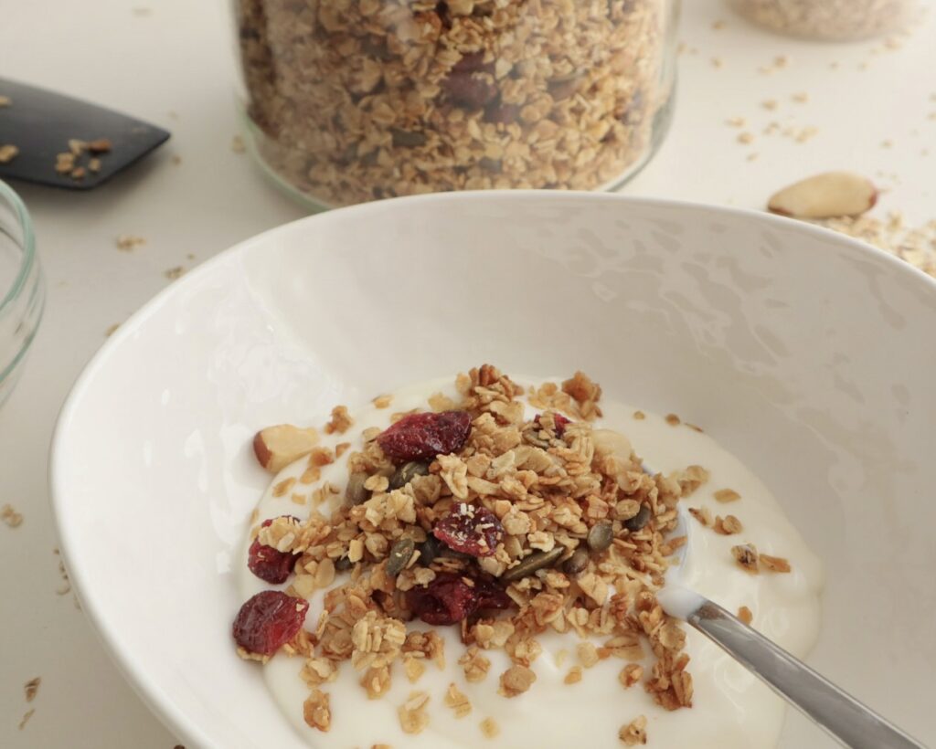 Homemade healthy granola in a bowl with yoghurt