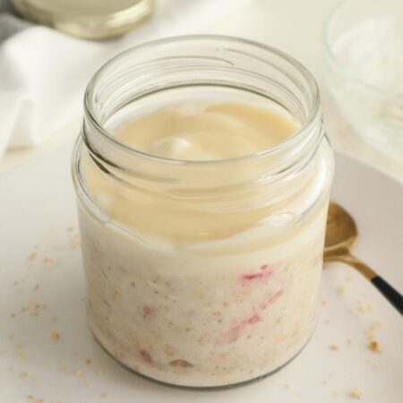 Strawberry Overnight Oats with Yoghurt and White Chocolate Topping