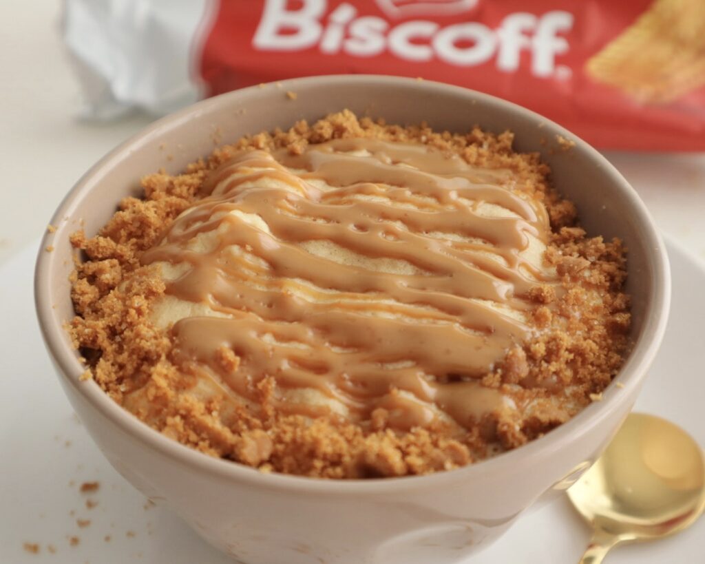 Smooth Biscoff spread drizzled over a protein cake