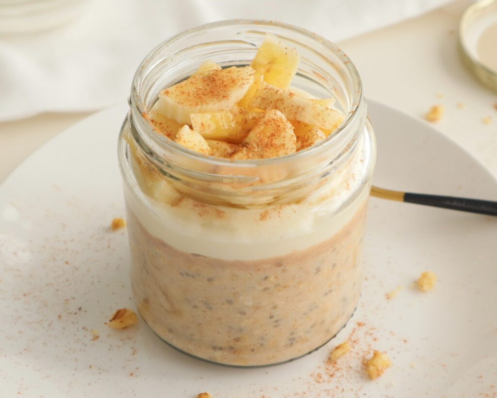 Banana Overnight Oats topped with protein. yogurt, banana and cinnamon