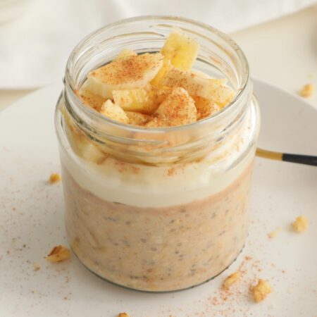 Banana Overnight Oats topped with protein. yogurt, banana and cinnamon