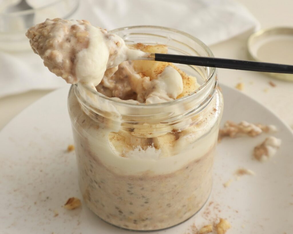 Inside view of cinnamon and walnut oats with yoghurt and banana